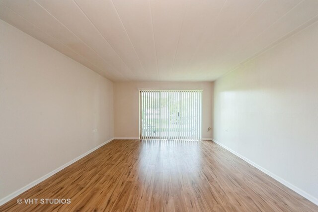 127 N Wolf Rd Unit 52A, Wheeling, IL 60090 - spare room with light wood-type flooring and baseboards