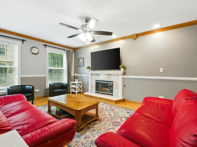 1386 Laurel Oaks Dr, Streamwood, IL 60107 - living area featuring crown molding, a ceiling fan, wood finished floors, and a tiled fireplace