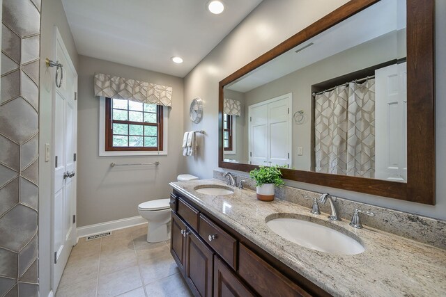 833 Manassas Ct, Naperville, IL 60540 - full bathroom with double vanity, tile patterned floors, and recessed lighting