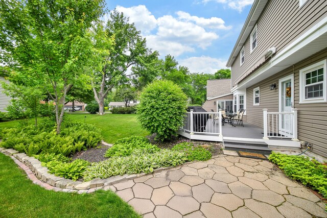 833 Manassas Ct, Naperville, IL 60540 - view of green lawn with a deck and outdoor dining area
