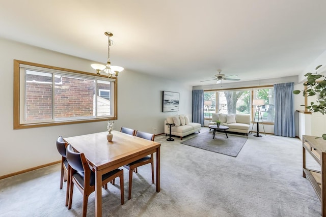 539 S Evergreen Ave, Arlington Heights, IL 60005 - dining space featuring light colored carpet, a chandelier, and a ceiling fan