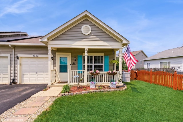 4321 Dillon St, Plano, IL 60545 - view of front of home with a porch, asphalt driveway, and a garage