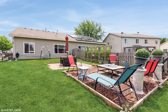4321 Dillon St, Plano, IL 60545 - back of house with a fenced backyard and a patio
