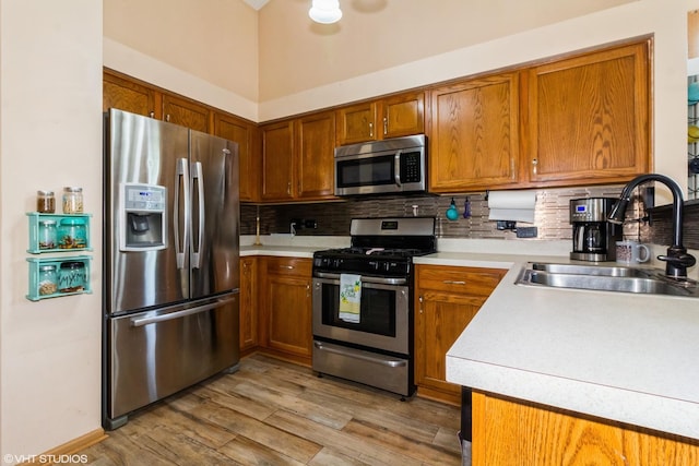4321 Dillon St, Plano, IL 60545 - kitchen with appliances with stainless steel finishes, brown cabinets, light countertops, and decorative backsplash