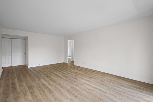 2000 Bayside Dr Unit 204, Palatine, IL 60074 - unfurnished bedroom featuring light wood-style flooring and a closet