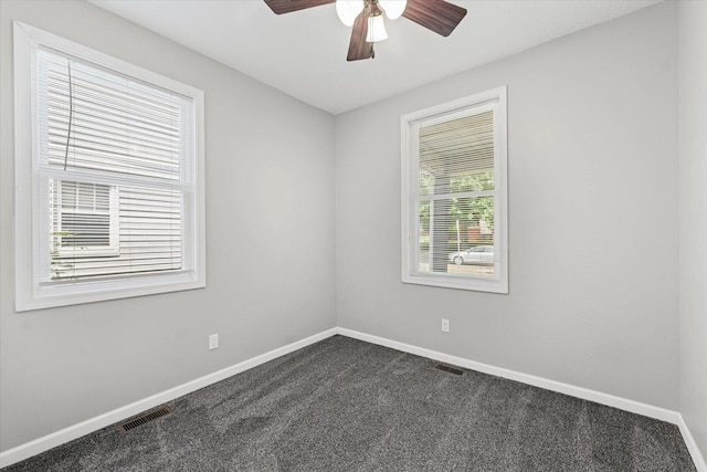1391 W Decatur St, Decatur, IL 62522 - unfurnished room with dark carpet and a ceiling fan