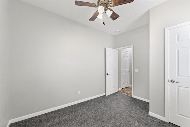 1391 W Decatur St, Decatur, IL 62522 - unfurnished bedroom featuring dark carpet and a ceiling fan
