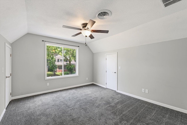 1391 W Decatur St, Decatur, IL 62522 - additional living space featuring vaulted ceiling, a ceiling fan, a textured ceiling, and carpet floors