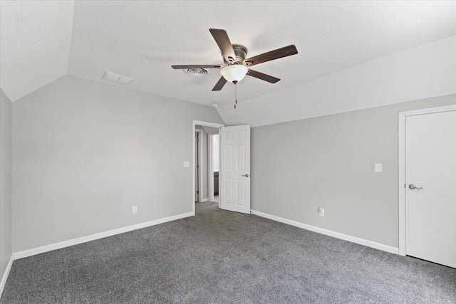 1391 W Decatur St, Decatur, IL 62522 - unfurnished bedroom with lofted ceiling, carpet flooring, ceiling fan, and a textured ceiling