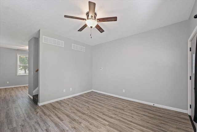 1391 W Decatur St, Decatur, IL 62522 - spare room featuring a ceiling fan and wood finished floors