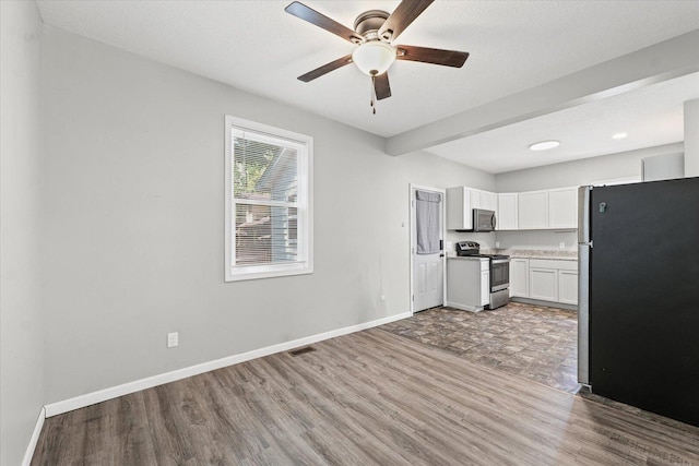 1391 W Decatur St, Decatur, IL 62522 - kitchen with appliances with stainless steel finishes, light wood-style flooring, ceiling fan, white cabinets, and light countertops