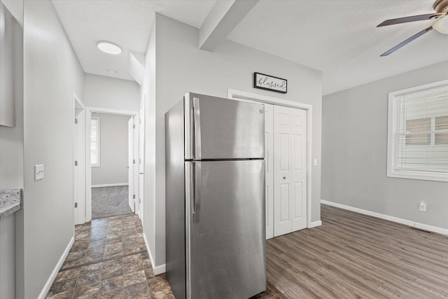1391 W Decatur St, Decatur, IL 62522 - kitchen with freestanding refrigerator, ceiling fan, a textured ceiling, and light countertops