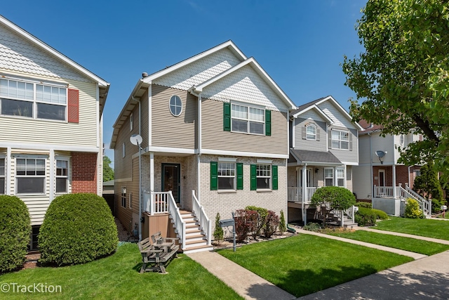 6158 W 60th St, Chicago, IL 60638 - townhome / multi-family property with a front yard and brick siding