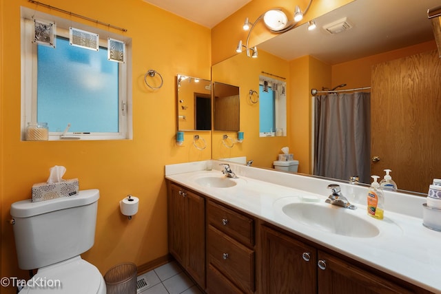 6158 W 60th St, Chicago, IL 60638 - bathroom with toilet, double vanity, tile patterned flooring, baseboards, and curtained shower