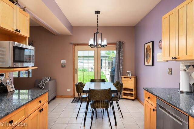 6158 W 60th St, Chicago, IL 60638 - dining area with a chandelier, plenty of natural light, light tile patterned flooring, and baseboards