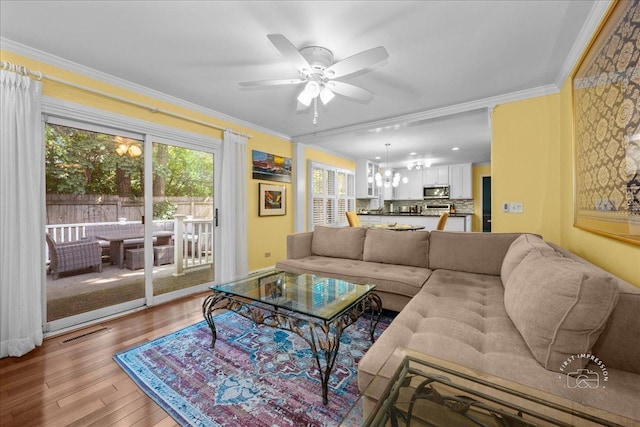 1519 Wedgefield Cir, Naperville, IL 60563 - living room with crown molding, light wood-type flooring, ceiling fan, and a chandelier
