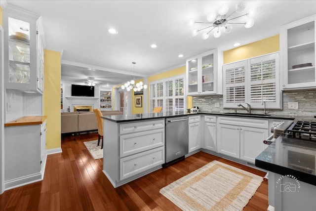 1519 Wedgefield Cir, Naperville, IL 60563 - kitchen with a chandelier, stainless steel dishwasher, a peninsula, open floor plan, and a fireplace