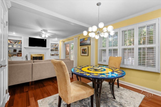 1519 Wedgefield Cir, Naperville, IL 60563 - dining area featuring crown molding, dark wood-style floors, a glass covered fireplace, ceiling fan, and a chandelier