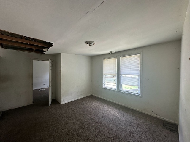 15201 Turlington Ave, Harvey, IL 60426 - unfurnished bedroom with dark colored carpet