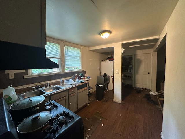 15201 Turlington Ave, Harvey, IL 60426 - kitchen with dark wood-style floors, black range, and a sink