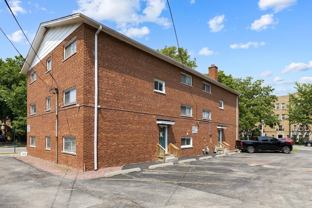 1107 Washington Blvd Unit 2E, Oak Park, IL 60302 - view of property with entry steps and uncovered parking