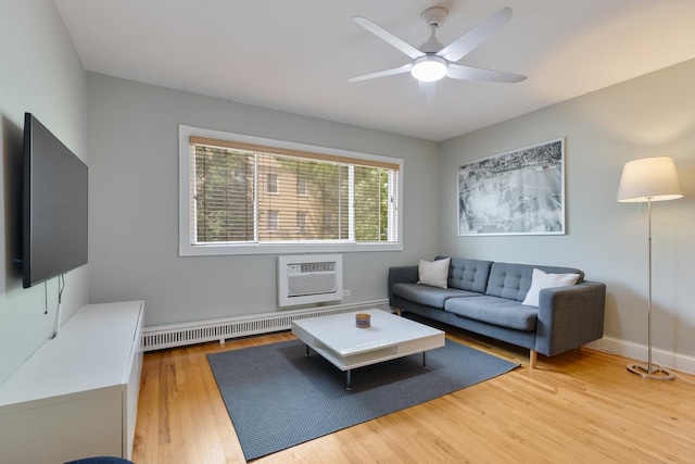 1107 Washington Blvd Unit 2E, Oak Park, IL 60302 - living area with a wall mounted AC, light wood-type flooring, ceiling fan, and radiator heating unit