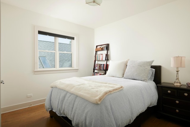 3828 N Racine Ave Unit 3, Chicago, IL 60613 - bedroom with dark wood-style flooring and baseboards