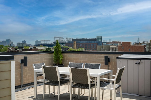 3828 N Racine Ave Unit 3, Chicago, IL 60613 - wooden terrace featuring a view of city and outdoor dining area