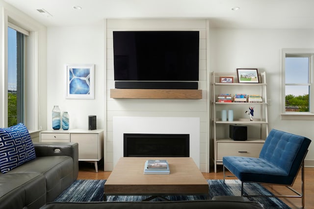 3828 N Racine Ave Unit 3, Chicago, IL 60613 - living room with wood finished floors, a fireplace, and recessed lighting