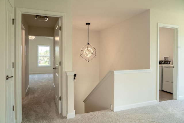LOT15 Amherst Dr Unit B, Sycamore, IL 60178 - corridor with an upstairs landing, carpet flooring, washer and clothes dryer, and baseboards