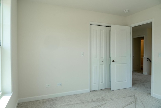 LOT15 Amherst Dr Unit B, Sycamore, IL 60178 - unfurnished bedroom with carpet flooring, a closet, and baseboards