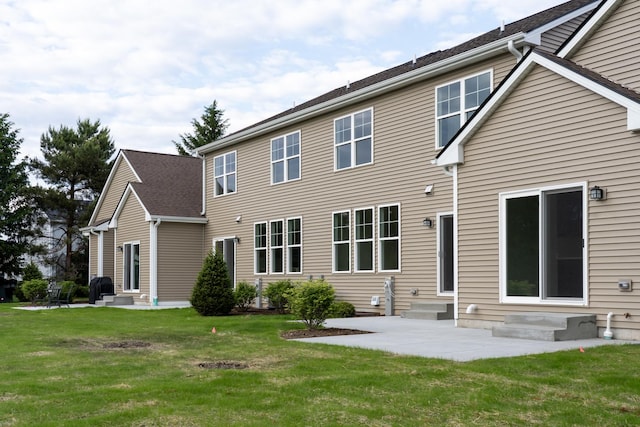 LOT15 Amherst Dr Unit B, Sycamore, IL 60178 - rear view of house featuring entry steps, a patio, and a yard