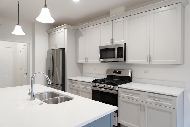 LOT15 Amherst Dr Unit B, Sycamore, IL 60178 - kitchen with appliances with stainless steel finishes, a sink, light countertops, decorative light fixtures, and white cabinetry