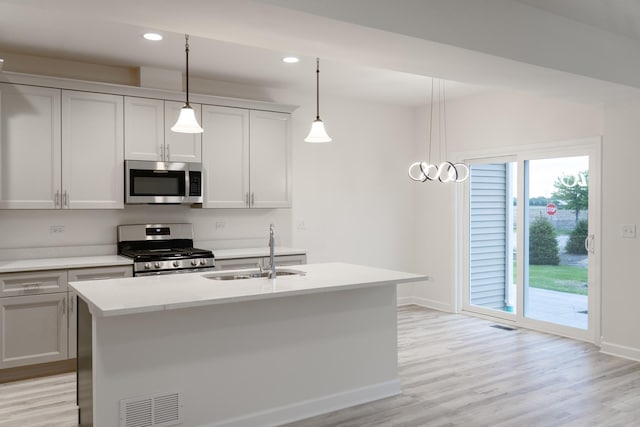 LOT15 Amherst Dr Unit B, Sycamore, IL 60178 - kitchen with appliances with stainless steel finishes, a sink, baseboards, light countertops, and light wood-style floors