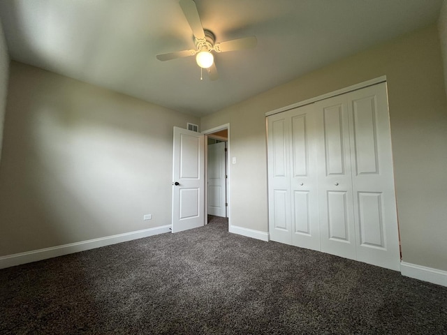 6047 Elm Ln, Matteson, IL 60443 - unfurnished bedroom with dark colored carpet, baseboards, and a closet