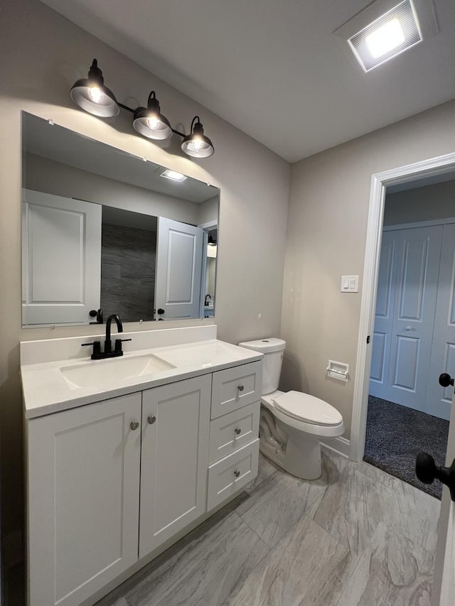 6047 Elm Ln, Matteson, IL 60443 - bathroom featuring vanity, toilet, and marble finish floors
