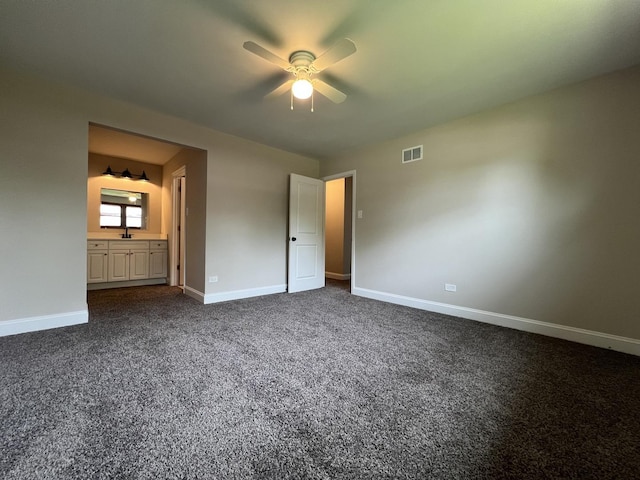 6047 Elm Ln, Matteson, IL 60443 - unfurnished bedroom featuring baseboards, dark colored carpet, a sink, ensuite bathroom, and a ceiling fan