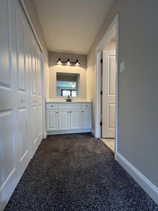 6047 Elm Ln, Matteson, IL 60443 - corridor with carpet, a sink, and baseboards