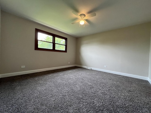 6047 Elm Ln, Matteson, IL 60443 - unfurnished room with ceiling fan, baseboards, and dark carpet