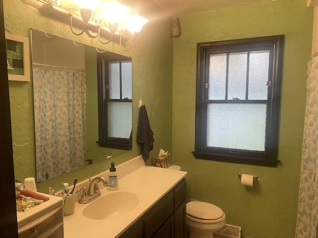 7545 Beloit Ave, Bridgeview, IL 60455 - bathroom with vanity, toilet, a textured wall, and a shower with shower curtain