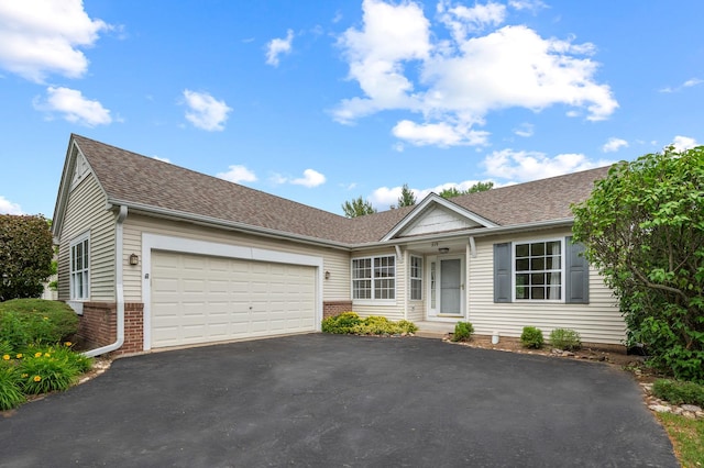 213 Stillwater Ct, Oswego, IL 60543 - ranch-style house with asphalt driveway, a garage, brick siding, and a shingled roof