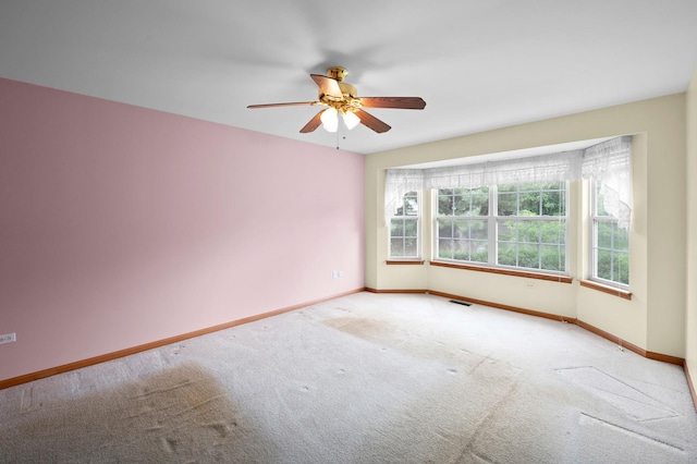 213 Stillwater Ct, Oswego, IL 60543 - spare room featuring carpet and ceiling fan