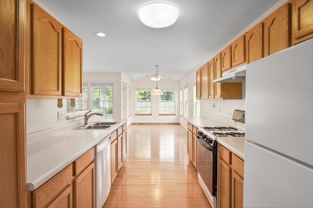 213 Stillwater Ct, Oswego, IL 60543 - kitchen featuring freestanding refrigerator, range with gas cooktop, under cabinet range hood, dishwasher, and light countertops