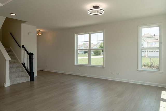 LOT15 Buckboard Ln Unit C, Sycamore, IL 60178 - unfurnished living room featuring wood finished floors, baseboards, and stairway