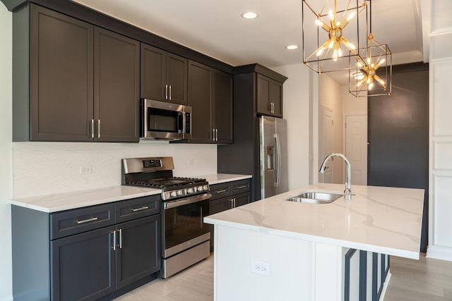 LOT15 Buckboard Ln Unit C, Sycamore, IL 60178 - kitchen with appliances with stainless steel finishes, a sink, a chandelier, recessed lighting, and a kitchen island with sink