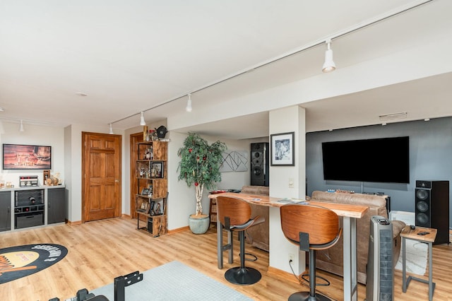 407 Anthony Ct, Oswego, IL 60543 - indoor dry bar featuring rail lighting and light wood-type flooring