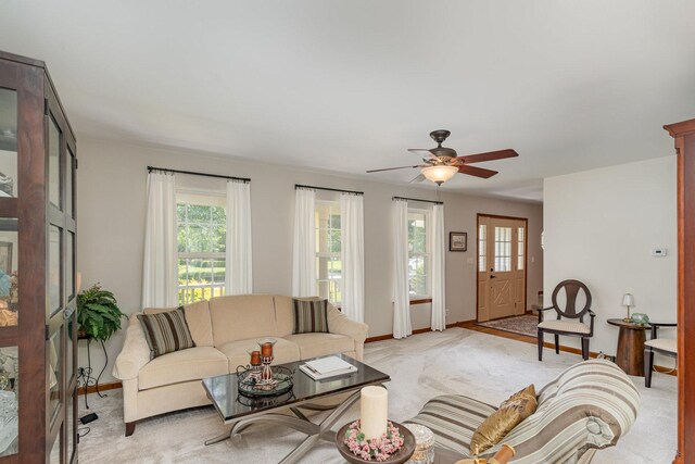 407 Anthony Ct, Oswego, IL 60543 - living room featuring plenty of natural light, light colored carpet, and ceiling fan