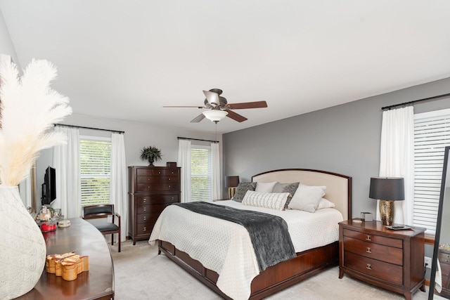 407 Anthony Ct, Oswego, IL 60543 - bedroom featuring light colored carpet, multiple windows, and ceiling fan