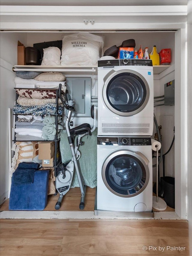 1150 N Lake Shore Dr Unit 19A, Chicago, IL 60611 - laundry room with estacked washer and dryer and wood finished floors