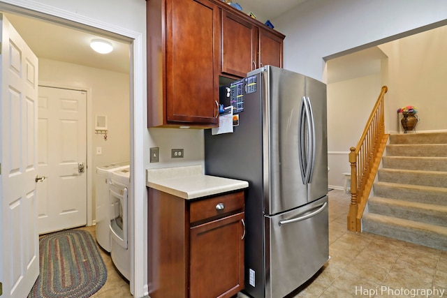 5208 Cobblers Xing Unit 5208, Mchenry, IL 60050 - kitchen featuring freestanding refrigerator, light countertops, separate washer and dryer, and light tile patterned floors